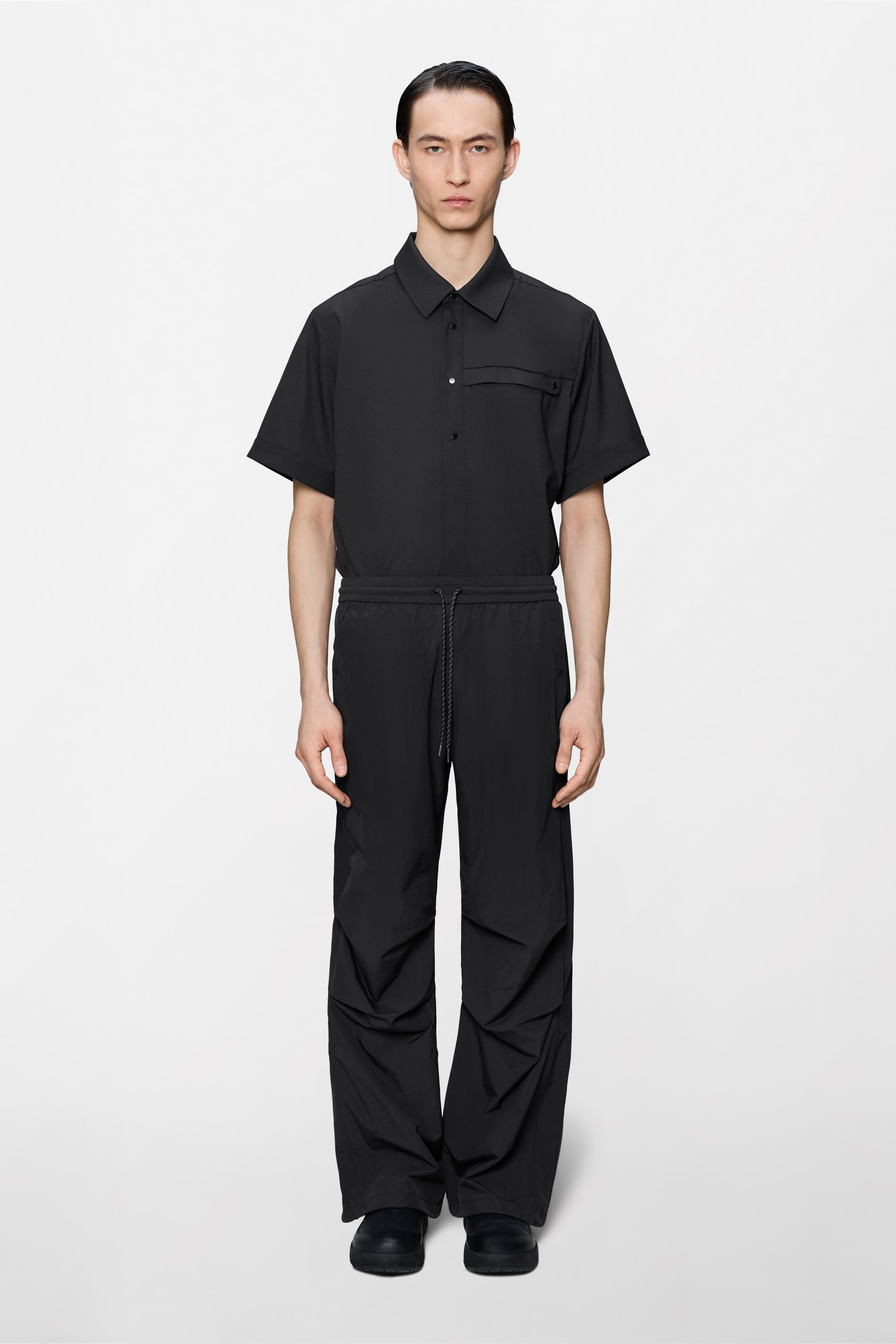 RAINS Cooldown Track Pants Black Pants